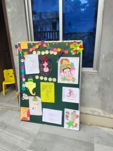 Board Decoration with images of God by class 4 Students