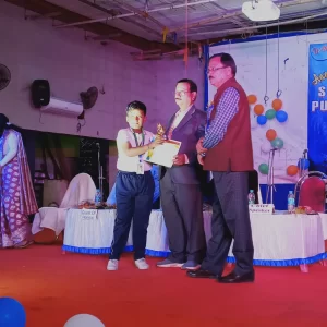 Honorable Principal Giving Prize To Little Champion
