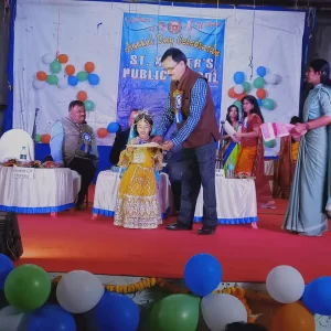 Honorable Principal Giving Prize To Little Champion