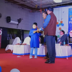 Honorable Principal Giving Prize To Little Champion