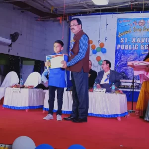 Honorable Principal Giving Prize To Little Champion